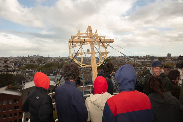 People raising a wifi dish