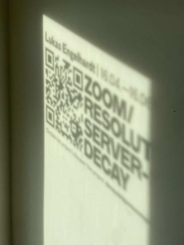 Shadow on the wall spelling out exhibition title