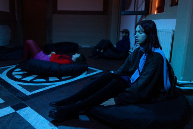 image of woman sitting and meditating